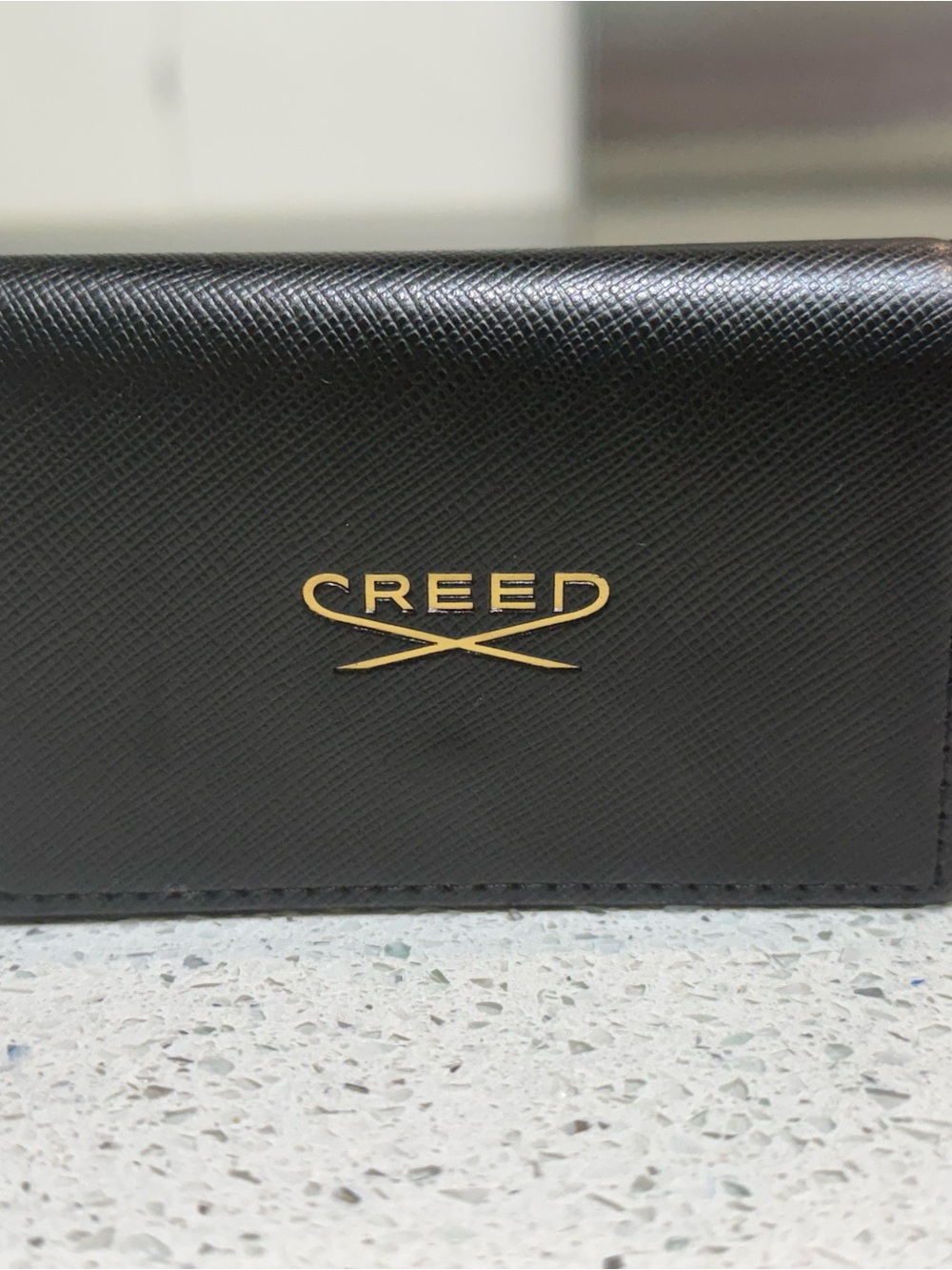 Creed Black Leather Card Case with Gold Emblem
